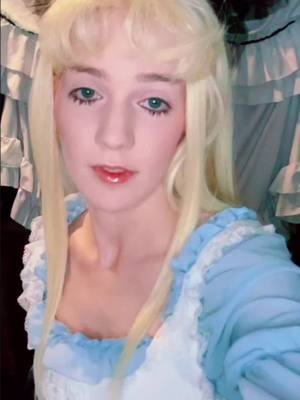 A post by @discount.yam on TikTok caption: brb watching this video every hour on the hour #discountalice #aliceinwonderland #alicecosplay #cosplayer #aliceinwonderlandcosplay #cosplay 