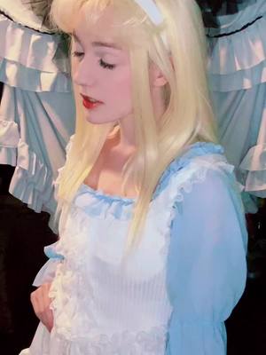 A post by @discount.yam on TikTok caption: My sassy little grumpy baby she cant ever catch a damn break #discountalice #aliceinwonderland #alicecosplay #cosplayer #aliceinwonderlandcosplay #cosplay 