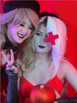 A post by @gillianfoxglove on TikTok caption: Charlie doesnt understand christmas but shes got the spirit #hazbinhotel #charliemorningstar #vaggie @Mangoloo Cosplays 🔜Anime NYC 