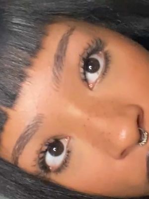 A post by @oliviasade on TikTok caption: micro bangs have entered the chat 