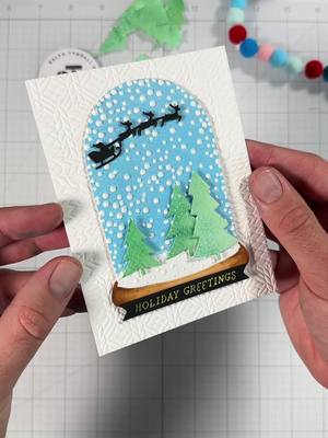 A post by @ralphtyndall on TikTok caption: Replying to @Mummer All in a day’s work!  This snowglobe embossing folder was the first Christmas embossing folder I ever purchased and it’s still one of my favorites. I never know quite how to use it…but I think I gave it a good shot here! #cardmaking #craft #asmr #art 