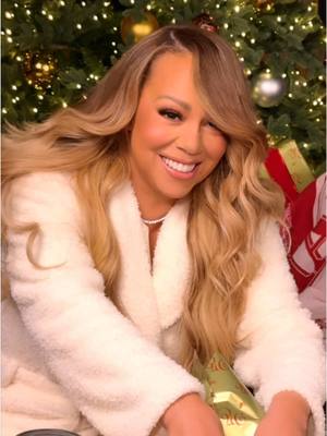 A post by @mariahcarey on TikTok caption: Time to wrap presents!!! What gifts are you wrapping this year?? 🎁🎄🎁🎄 #christmasmusic 