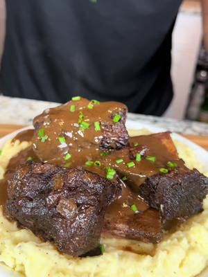 A post by @eatwitzo on TikTok caption: Braised Beef Short ribs 🥩 Nothing screams holidays like slow cooked beef short ribs! Pretty easy to make and a certified crowd pleaser! Enjoy!  Full ingredient list:  6-8 short ribs  3 stalks celery chopped  3-4 carrots chopped  1 onion diced  1 whole head garlic  1/2 bottle red wine  4-6 cups beef broth  2-3 tbsp butter diced  2-3 rosemary spigs  2-3 thyme sprigs  2 tbsp tomato paste  1 1/2 - 3 tsp onion powder  1 1/2 - 3 tsp garlic powder  1 tsp flour  Salt to taste  Pepper to taste  Tip: Seasoning amount will vary depending on size/amount of short ribs. Start moderately and adjust seasoning as needed! #shortribs #holidays #eatwitzo 