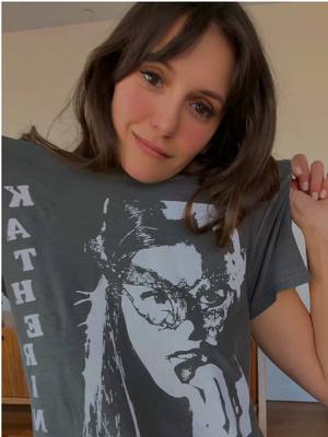 A post by @nina on TikTok caption: its giving Katherine 😉🧛🏻‍♀️ why pick one when you can have both? 2 in 1 REVERSABLE Tshirt. Pop up ENDS AT MIDNIGHT TONIGHT. Link in bio. 