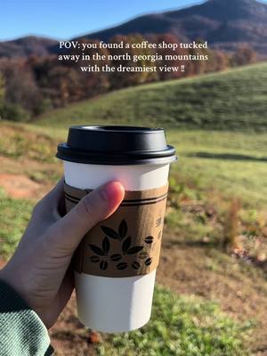 A post by @emily.netzel on TikTok caption: can’t beat a good cup of coffee with a beautiful view @Jumpin Goat Coffee #coffeetok #northgeorgia #clevelandga #jumpingoat 