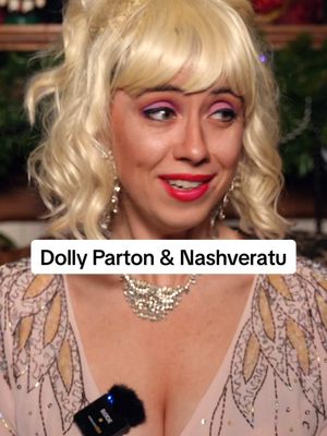 A post by @andimariere on TikTok caption: Dolly can warm even the coldest of hearts. Watch FULL Nashveratu Count-ry Christmas special now on Patreon. 🔗in bio🧛‍♀️🖤💖 #dolly #nosferatu #southern #yallternative 