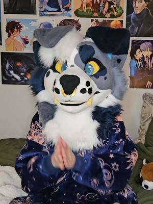 A post by @strayfurstudios on TikTok caption: Just a little something fun 💙 I always liked this trend~ I was also a drum major in back in highschool, which helps - - - #furrytiktok #fursuits #caninefursuit #furry #furrycommunity #fursuit #fursuiting #fursuiter #bluedog #pentatonix #trend #christmas 