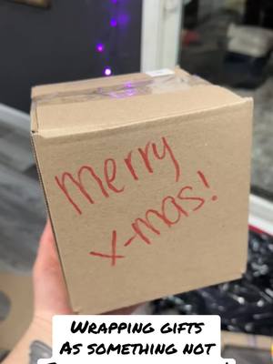 A post by @jamiekontaxis on TikTok caption: The time it took to do this… 😂 #fyp #funnyvideo #christmas #wrapping 