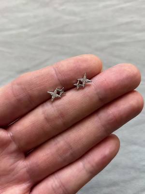 A post by @qi_qcs on TikTok caption: 💫CZ star stud earrings#earrings #men #women #studearrings #unisex #2025 