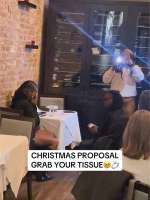 A post by @theeerealburnell on TikTok caption: She Couldn’t Do Nothing But Cry! #proposal #shesaidyes #christmas #holiday #singing #bride #groom #fiance #love #tears #fyp #foryoupage #neworleans #burnelltaylor 