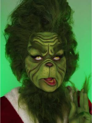 A post by @illumin_arty on TikTok caption: Rate my Grinch makeup 1-10 👀💚 #grinch #makeup #thegrinch #christmasmakeup #grinchmakeup #makeup 