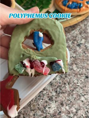 A post by @page_of_space on TikTok caption: Yumyyyyy #epicthemusical #polyphemus #odyssey #theodyssey #cyclops #christmascookies #gingerbread 