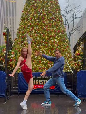 A post by @melissabecraft on TikTok caption: NYC gave us rain but we gave it a show! Merry Christmas! DC: @chloe kleiner 🎄🎁❤️ #christmas #dance #nycatchristmas #newyork