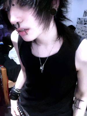 A post by @morbiddog on TikTok caption: merry crisis  __ #emo#scemo#alt#goth 
