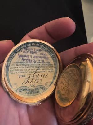 A post by @bigcat111169 on TikTok caption: 🎄 Christmas Miracle! My Grandpa Gordon’s watch still runs after 120 years 😮  Still has the ticket from when it was repaired in 1903