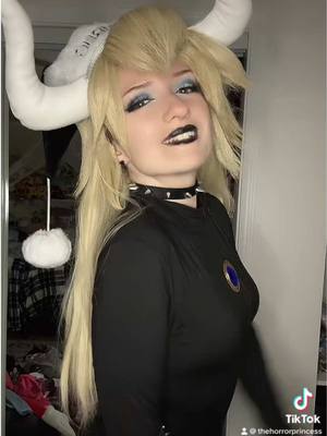 A post by @lostprincessashlee on TikTok caption: merry christmas from bowsette 🖤⛓️🎄 #christmas #cosplay #bowsette #bowsettecosplay 