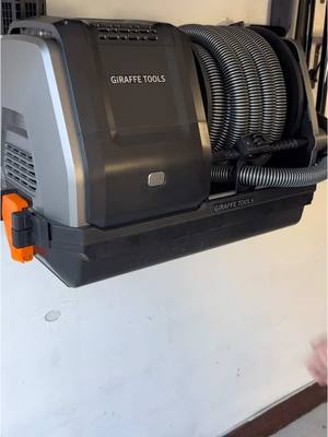 A post by @avwooddesigns on TikTok caption: I recently found the most convenient vacuum cleaner , the retractable vacuum cleaner.  Whether you’re cleaning your car or workshop,this powerful vacuum gets the job done. @Giraffe-Tools  #DIY #vacuum #garage #Home