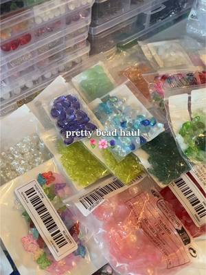 A post by @starla.co.shop on TikTok caption: bead haul 🪻🌸🌷 (repost bc this is one of my favorite hauls hehe) #beadhaul #beads #beadsasmr #beadedjewelry #beadsjewelry #jewelrymaking #fyp