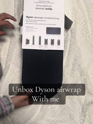 A post by @amychavez3 on TikTok caption: #dyson #dysonairwrap #chrismasgifts #present #hair #Love 