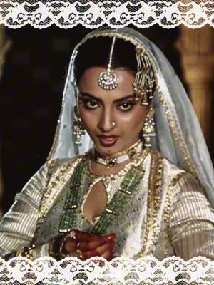 A post by @lixlenna on TikTok caption: one of her most iconic costumes #rekha #icon #iconic #fashion #bollywoodfashion #bollywoodedit #rekha #indiantiktok #indian #desiwomen #women #ishq #mohabbat #urdu #urduaesthetic #oldbollywood #rekhaji #rekhajifan #umrao #umraojaan #bollywoodmusic #edits #urduaesthetic 