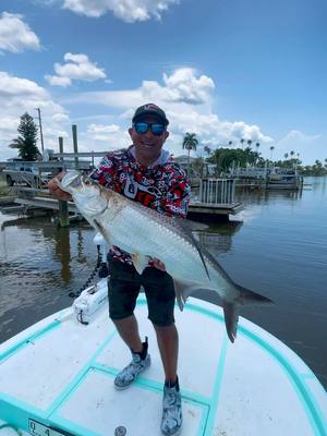 A post by @urbanfloridafishing on TikTok caption: Gotta love the way tarpon fight what an adrenaline rush🙌🔥 Capt @Slade hit him for a trip💪 #urbanfloridafishing #tarponfishing #fishing 