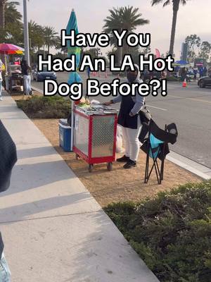 A post by @lafoodieguy on TikTok caption: Definitely one of LA’s favorite pre- or post-event snacks‼️🔥🌭 #california #losangeles #food #fyp #hotdog #rams #sofistadium #nfl #inglewood 