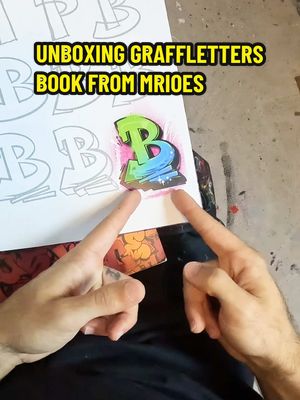 A post by @sprayculture on TikTok caption: Unboxing GRAFFLETTERS book from MRIOES ⚡️ Get the book on mrioes.com 👈 The GRAFFLETTERS-BOOK contains 160 pages and over 3000 letters and its perfect for beginners and graffiti enthusiasts.  #unboxing #book #graffletters #asmr #pov #resk12 #atelier #youtube  #mrioes #books #review #fyp #foryou #fypシ゚ #fypp 