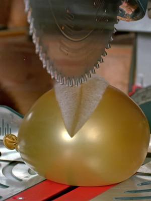 A post by @blacktailstudio on TikTok caption: Water balloon vs saw blade in slow motion