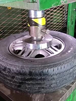 A post by @hpc_official on TikTok caption: Crushing a massive tire #asmr #crush #hydraulicpress 