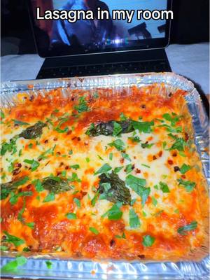 A post by @lazypotnoodle on TikTok caption: Making Lasagna in my room! 🥫🧀🍽️ This was super easy to make, and I’m definately going to have leftovers lol. Also, Squid Game season 2 is so good! 🤐 INGREDIENTS NEEDED 👇  * Olive oil * White onion * Garlic * Ground beef * Ground sausage * Tomato paste * Tomato sauce * Beef broth (optional) * Lasagna sheets * Salt & Pepper * Onion powder * Garlic powder * Oregano * Chopped Parsely * Chopped Basil * Red Pepper flakes (optional) * 1 egg * Ricotta cheese * Shredded Parmesan  * Shredded Mozzarella #lazypotnoodle #food #Foodie #foodies #foodtiktok #FoodTok #EasyRecipes #EasyRecipe #comfortfood #newyear #lasagna #italianfood #italian #pasta #lasagnarecipe #lasagnas 