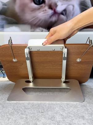 A post by @coolgadget_official on TikTok caption: Laptop holder and also a book holder#laptopholder #bookholder #coolgadgets #fyp #laptop #macbook 