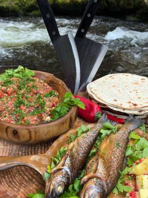 A post by @thenikosknifee on TikTok caption: Fresh Caught Trout by the River 🤤🎣 #fishing #fish #trout #outdoorcooking #asmrcooking 