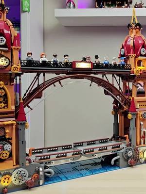 A post by @thetoystore08 on TikTok caption: Bridge to Steampunk Paradise #Steampunk #Bridge #Funwhole #Lighting #Bricks #Architecture #Model #Adults #City #Building 