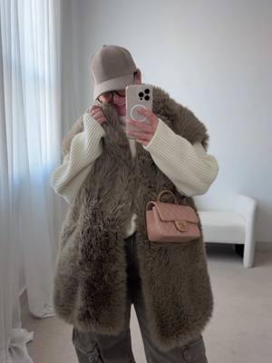 A post by @julia.marie.bb on TikTok caption: Clearing out my drafts Fur vest: old Mango Cargo Jeans: old Zara Men’s