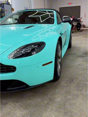 A post by @thewrapdaddy on TikTok caption: Aston Martin Vantage GT Wrapped with ARMR minty fresh! Added a couple satin grey metallic accents on mirrors and fenders.  Ceramic coated all ppf, vinyl, lamps and glass.  👌 ✨ @WrapFresh #armrmintyfresh #astonmartin #vantage #cargoals #dreamcar  #wrappedcars #colorppf #ppf #cars 