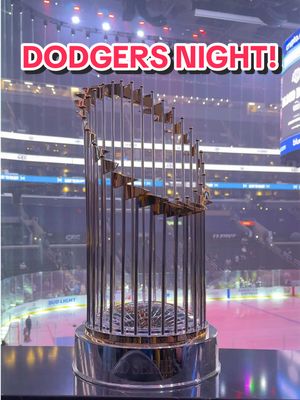 A post by @dodgers on TikTok caption: The World Series trophy is in the house for Dodgers Night at @LA Kings! #dodgers #kings #sports #hockey #losangeles 