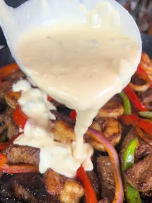 A post by @eatwitzo on TikTok caption: Steak and Shrimp Fajitas! 🥩🍤  There’s nothing like hearing that sizzle of the fajitas coming from around the corner in the restaurant! Even better when they’re home made!  Full ingredient list:  1-2 lb steak sliced  1 lb shrimp  1 red and green bell pepper sliced  1/2 onion sliced  2-3 tsp garlic powder  2-3 tsp onion powder  2-3 tsp ground cumin  2-3 tsp chili powder  1-2 tsp black pepper  1-2 tsp salt  2 tsp diced chipotle peppers  For queso:  1 tbsp butter  2 tbsp flour  1-2 cups evaporated milk  1.5 lb shredded white cheddar/mozzarella mix