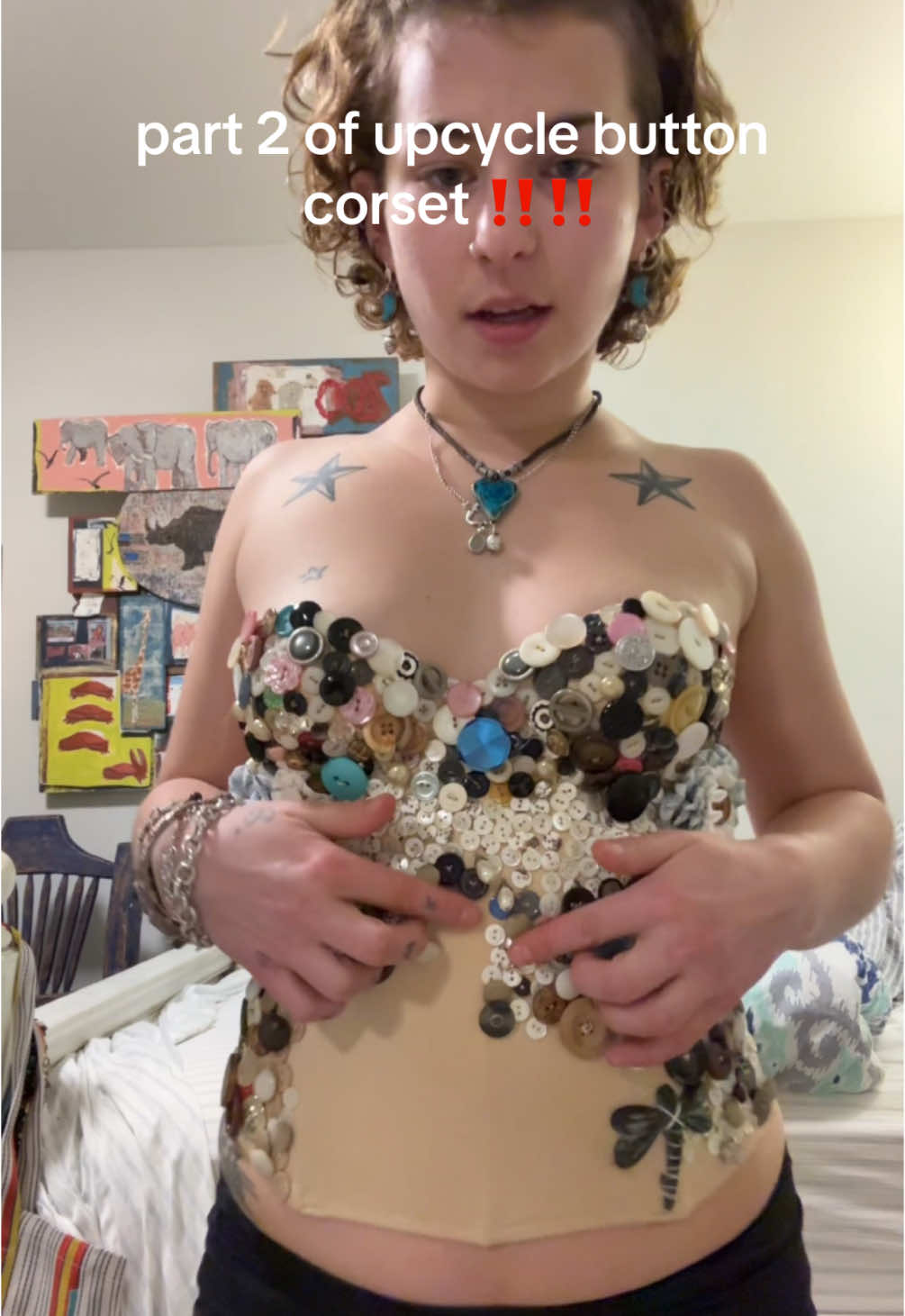 A post by @sydneyl3vy on TikTok caption: part 2 no one asked for…. shout out to mama for more buttons #upcycle #fashion #sewing #buttons #cat #taco  