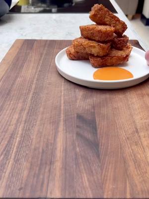 A post by @chefthombateman on TikTok caption: Hash Browns. Been at least 3 weeks since I did a hash brown video lol  Makes 6-8  800g Maris piper potato Veg oil or Beef Fat 2 cloves of garlic Handful fresh rosemary Handful fresh thyme 2-3 tbsp cornflour  Salt Pepper 1. Peel and grate the potato, submerge in cold water for 5 mins then strain off 2. Squeeze out as much liquid as possible 3. Cover with oil in a large pan season with salt, pepper, garlic, thyme and rosemary. 4. Cook on a low heat for 20-25 mins without colour 5. Strain off the oil but keep it as we fry in this later 6. Mix the potato with cornflour and shape either with your hands or in moulds. Set in the freezer for 40-45 mins  7. Use the oil from earlier to fry them at 175c until golden and crispy all over #hashbrowns #potato #basic #potatoes #Recipe #cooking #reels #comfortfood #EasyRecipes 