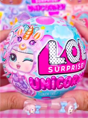 A post by @tiktoksupers on TikTok caption: Unboxing the new 2025 LOL Surprise Magical Unicorns! 💜 with lava lamp liquid and hair swapping? #lolsurprise #loldolls #unboxing #toys #unicorn 