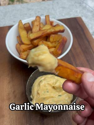 A post by @chefthombateman on TikTok caption: Punchy Garlic Mayonnaise - very quick to make without a lot of fuss and it’s properly delicious. Call it Aioli if you must but it’s not really  3 large garlic cloves or however many you want 1 tbsp olive oil Pinch of sea salt 2 handfuls of flat leaf parsley  2 egg yolks 1 1/2 tsp Dijon mustard Squeeze of lemon juice 1 tsp sherry vinegar  Approx 200ml of neutral flavoured oil like veg oil. 1. Grind the garlic in a pestle and mortar with the olive oil, salt and parsley you could you a blender  2. Add the egg yolk, lemon, mustard and vinegar to a mixing and whisk. 3. Stream in the oil slowly as you whisk to form the mayo. Add the garlic paste and salt/lemon as required. #garlic #mayonnaise #sauce #Recipe #EasyRecipes #EasyRecipe #cooking #cookingtime #egg #garlicsauce 