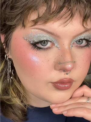 A post by @katieartistry on TikTok caption: feelin like a disco ball 🪩 #editoralmakeup #creativemakeup #makeup #makeupartist 