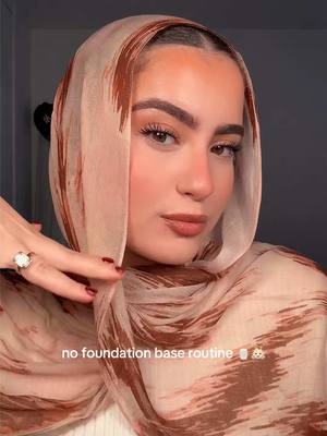 A post by @sallypoo on TikTok caption: no foundation look in my cheetah camo vela🧴👼🏻 @rhode skin @Peach & Lily @Too Faced @Hourglass Cosmetics @Patrick Ta Beauty @Huda Beauty @makeupbymario @milkmakeup @VELA #hijabi #makeup #makeuphacks #beauty #makeuptutorial #vela #nofoundationmakeup #fypシ 