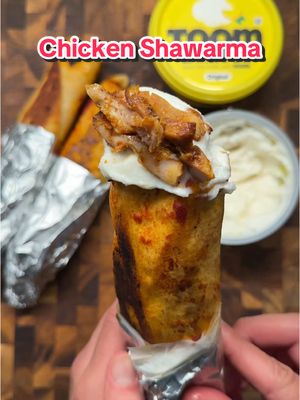 A post by @ice.karimcooks on TikTok caption: SAVE this ‼️ The BEST Chicken Shawarma Recipe EVER 🇱🇧😍 (recipe 👇🏽)  Ingredients: For the Chicken: 	•	2 lbs chicken thighs 🍗 	•	1 large white onion, thinly sliced 🧅 	•	1 tbsp salt 🧂 	•	2 tsp pepper 	•	2 tsp onion powder 	•	2 tsp chili powder 	•	1/2 tsp cumin 	•	2 tbsp tomato paste 🍅 	•	2-3 tbsp olive oil 🫒 	•	2 tbsp @TOOM Garlic Dips paste 	•	1 lemon, halved 🍋 For Assembling Sandwiches: 	•	Air fried French fries 🍟 	•	Arabic pickles 🥒 	•	2 large Arabic pitas, halved 🥙 	•	Olive oil + tomato paste mixture for brushing 🖌️ Instructions: 1.Marinate the Chicken: In a large bowl, combine the chicken thighs with the onions, salt, pepper, onion powder, chili powder, cumin, tomato paste, olive oil, and toom paste. Squeeze the juice from the lemon over the mixture, stir well, and let marinate for 20-30 minutes. 2.Broil the Chicken: Spread the marinated chicken and onions on a baking sheet. Broil on high for 15-17 minutes, flipping halfway through until the chicken is thoroughly cooked and slightly charred. 3.Prepare the Sandwiches: Slice the chicken into strips. Spread toom paste inside a halved pita, add chicken, a layer of air-fried French fries, and Arabic pickles. 4.Toast the Sandwiches: Wrap the pita tightly around the fillings. Brush the outside with the olive oil and tomato paste mixture. Toast in a pan over medium heat until each side is golden brown. 5.Serve: Enjoy the warm, flavorful chicken shawarma sandwiches, perfect for a hearty meal. . . . #icekarim #EasyRecipes #mealprep #quickrecipes #toompartner  