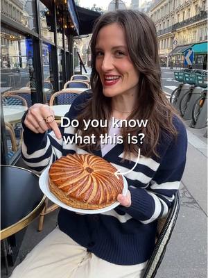 A post by @hellofrenchnyc on TikTok caption: What’s la galette des rois?? 👑A delicious French tradition! It’s the beginning of the Epiphany (🇫🇷l’épiphanie) season, and in France we celebrate with a unique pastry called la galette des rois—a king cake. This decadent pastry is filled with almond cream (🇫🇷la frangipane) and made with layers of buttery puff pastry (🇫🇷la pâte feuilletée). 🔎 Hidden inside the galette is a fève, a small secret charm, often made in ceramic. Whoever finds it becomes the king (🇫🇷le roi) or queen (🇫🇷la reine) for the day, and gets to wear a crown. The youngest person in the group usually hides under the table to ensure the slices (🇫🇷les parts) are distributed fairly by naming the recipient of each piece. You’ll find galettes des rois in French bakeries throughout the month of January (🇫🇷janvier). They’re an indulgent way to embrace French culinary traditions, and maybe even be crowned for a day! ✨ 👉Have you tried a galette des rois before? If so, who found the fève? 🇫🇷French vocabulary recap:  une galette des rois = a king cake  la pâte feuilletée = puff pastry  la frangipane = almond mixture/cream  la fève = the charm  le roi = the king  la reine = the queen  la couronne = the crown  une boulangerie = a bakery janvier = January . . #French #France #Paris #GaletteDesRois #KingCake #FrenchFood #FrenchCuisine  