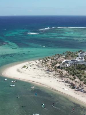 A post by @ion.club on TikTok caption: Mauritius - the paradise for windsurfers 🌴  Whether you're a beginner or expert, enjoy ideal conditions to ride, jump, and push your limits in a dream setting. Ready ? 🏄‍♂️  📍mauritius  #ionclub #windsurf #lemorne #mauritiusadventure