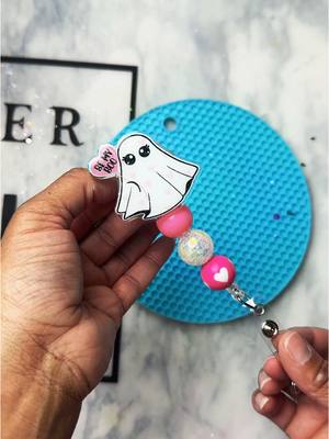 A post by @kreativesbykia on TikTok caption: Be my Boo👻🩷 Loving this badge reel UV Resin @counterculturediy  #badgereel #processvideo #bemyboo #pink #hearts #nursebadge #nursebadgereel #teacherbadgereel #badgeholder