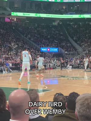 A post by @bucks on TikTok caption: Behind-the-back pass from Giannis to AJ Green for a monster THREE! 🔥 #dairybird #giannis 