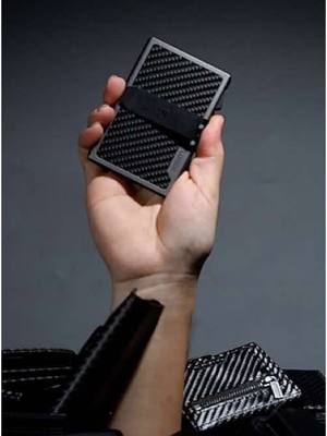 A post by @lorzorwallet on TikTok caption: Breaking through the fakes——Lorzor Wallet #lorzor #lorzorwallet #slimwallet #everydaycarry #realcarbonfiber 