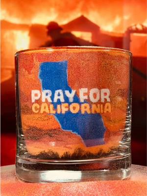 A post by @fallinginsand on TikTok caption: Pray for California #californiawildfires #california #lawildfires #losangeles #sandart #fallinginsand 